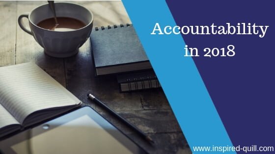 A blog feature image showing a cup of coffee next to notebooks and a pencil with the title 'Accountability in 2018' over the top